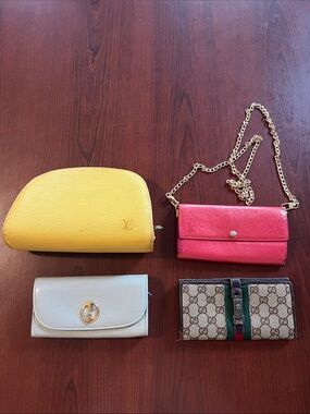 LV cosmetics bag, LV Sarah wallet, two Gucci wallets